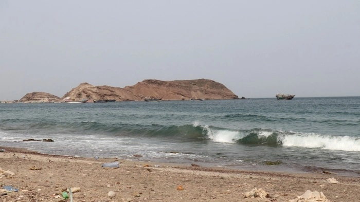 A photo taken from the Yemeni coast southwest of the city of Taiz, shows boats floating at Bab al-Mandab Strait, in the Red Sea, on July 24, 2026. A Houthi spokesman said on July 24, that the rebels were not blocking traffic through the strategic Bab al-Mandeb Strait, after they declared a maritime embargo this week on their foe Saudi Arabia. (Photo by Khaled ZIAD / AFP)