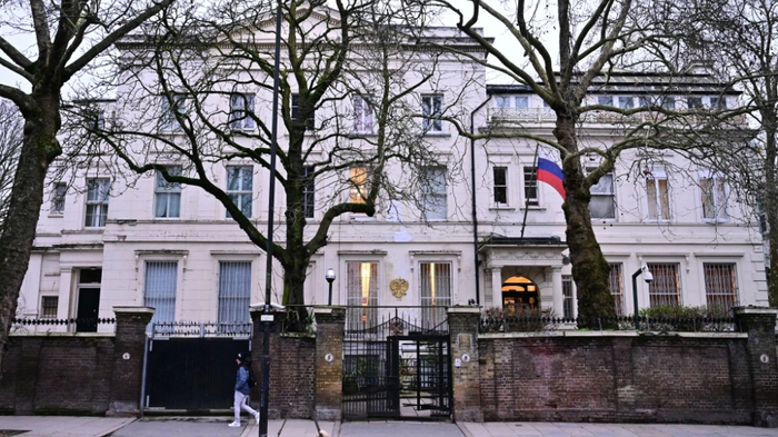 The Russian flag hangs outside the Russian Embassy in London on February 2, 2026. The UK has revoked a Russian diplomat's accreditation in a tit-for-tat move after Moscow expelled a British envoy last month, the foreign ministry in London said on Monday. (Photo by Ben STANSALL / AFP)