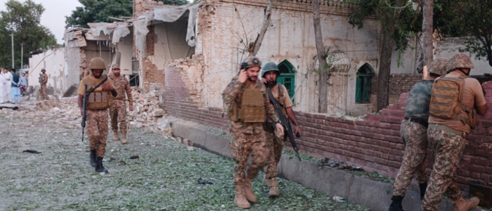 Army personnel inspect following an explosion inside the police headquarters at Kohat in Pakistan's Khyber Pakhtunkhwa province on September 18, 2026. An explosion at a historic police headquarters in northern Pakistan on September 18 killed at least eight people and wounded 35 more, officials said, with the country's president swiftly blaming a militant group. (Photo by Basit SHAH / AFP)