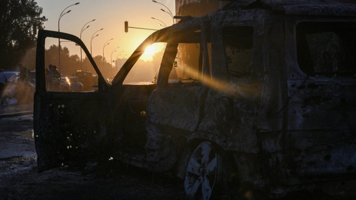 This photograph shows a destroyed car following a Russian ballistic missile strike in the Ukrainian capital of Kyiv on August 1, 2026, amid the Russian invasion in Ukraine. Russian attacks on Ukraine's capital killed at least nine people and wounded more than two dozen others, local officials said on August 1, 2026 , with strikes damaging homes and causing fires across the city. As Moscow has increased its long-range strikes on Ukrainian towns and cities, Kiev has pressed its allies for air defence support. The United Nations found June 2026 was the deadliest month for civilians in Ukraine since April 2022. (Photo by Genya SAVILOV / AFP)