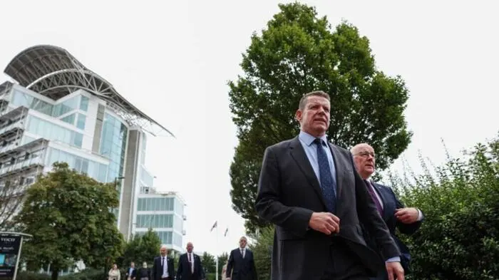Scottish Nationalist Party (SNP) leader John Swinney (behind R) walks with Rhun ap Iorwerth (2nd R) of Plaid Cymru in Wales to the parliament building after attending a meeting with the leaders of the main Scottish, Northern Irish and Welsh parties in Cardiff, Wales on September 14, 2026, to press for self-determination votes in their territories. The leaders of the main Scottish, Northern Irish and Welsh parties on September 14 declared their right to "self determination" in a joint agreement signed at a rare meeting in the Welsh capital Cardiff. (Photo by Adrian DENNIS / AFP)