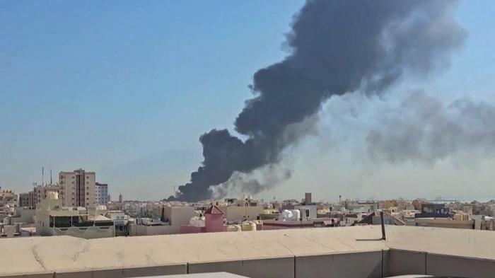 This screen grab taken from UGC video footage posted on social media on July 18, 2026, shows a plume of black smoke billowing over the town of Mangaf, south of Kuwait City. Kuwait accused Iran on July 18 of targeting civilian sites and vital infrastructure in the country, after reporting attacks on an oil facility and a power and water plant. (Photo by various sources / AFP) / RESTRICTED TO EDITORIAL USE - MANDATORY CREDIT AFP - SOURCE: UGC / UNKNOWN - DISTRIBUTED AS A SERVICE TO CLIENTS - NO ARCHIVE - NO RESALE - NO USE AFTER: JULY 27, 2026 15:00:00 GMT