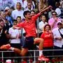 TOPSHOT - Serbia's Novak Djokovic jumps as he celebrates his victory over Norway's Casper Ruud during their men's singles final match on day fifteen of the Roland-Garros Open tennis tournament at the Court Philippe-Chatrier in Paris on June 11, 2023. (Photo by Emmanuel DUNAND / AFP)