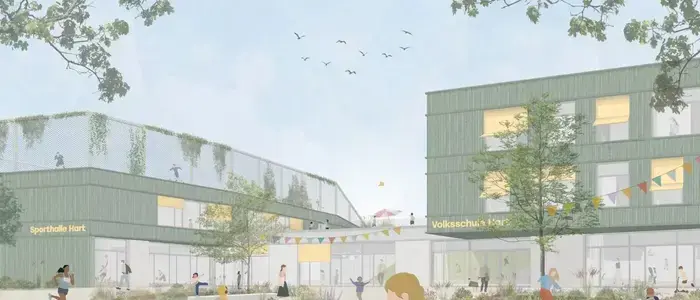 Ein Modell zeigt das Schulgebäude, wie es aussehen soll. Neben der Schule befindet sich eine Sporthalle auf deren Dach ebenfalls gespielt werden kann.