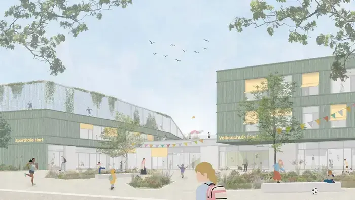 Ein Modell zeigt das Schulgebäude, wie es aussehen soll. Neben der Schule befindet sich eine Sporthalle auf deren Dach ebenfalls gespielt werden kann.