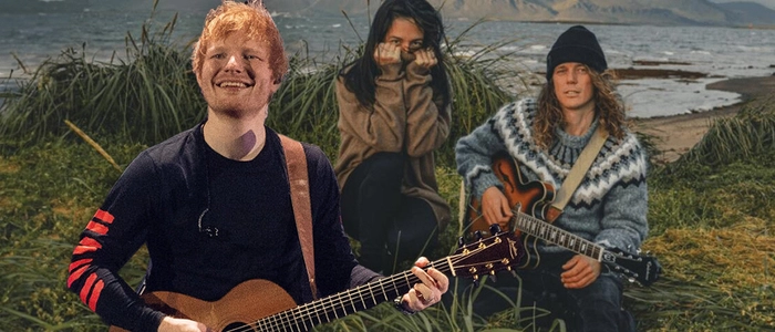 Ed Sheeran und die beiden Musiker vor einer Küstenlandschaft in Island, wo sie ein Musikvideo drehten