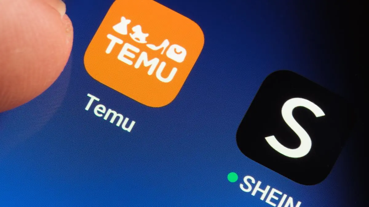 TEMU and SHEIN apps seen on the screen of smartphone. Temu app and Shein app are chinese budget shopping platforms. Stafford, United Kindom, May 2, 2023