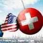 USA vs Switzerland Economic Conflict Concept – American Boxing Glove Punching Swiss Wrecking Ball