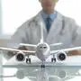 Medical tourism and medical hub concept, traveling internationally for medical care, treatment of specific diseases, airplane model on the table and doctor behind