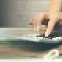 woman hand calculator and notepad